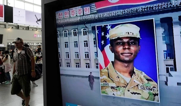 A TV screen shows a file image of American soldier Travis King during a news program at the Seoul Railway Station in Seoul, South Korea, Wednesday, August 16, 2023 (AP)