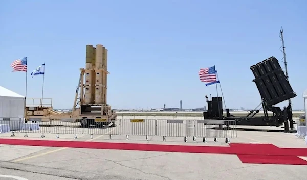 A handout picture released by the Israeli Ministry of Defense (IMDO) on July 12, 2022, shows the Arrow (L) and Iron Dome systems, part of Israel’s multi-tiered air defense system on display at Israel’s Ben Gurion Airport in Lod near Tel Aviv. (AFP)