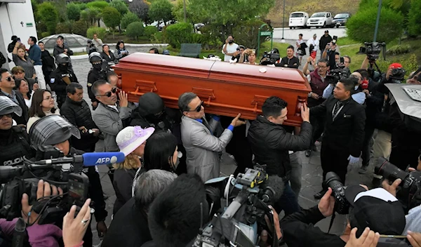 The coffin of slain Ecuadorian presidential candidate Fernando Villavicencio is being carried on August 11, 2023 (AFP)