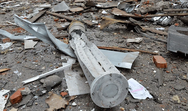 A view shows the internal components of a 300mm rocket which appear to contained cluster bombs launched from a BM-30 Smerch multiple rocket launcher in Ukraine's second-biggest city of Kharkiv on March 3, 2022, during war in Ukraine. (AFP)