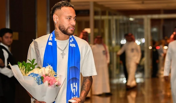 Brazilian national team's historical top scorer and the star of Paris Saint-Germain, Neymar Jr. arrives at King Khalid International Airport in Riyadh, Saudi Arabia, Friday, Aug. 18, 2023. (AP)