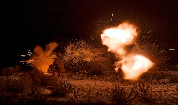 A Ukrainian soldier fires during night training in Donetsk, Donetsk People's Republic, August 17, 2023 (AP)