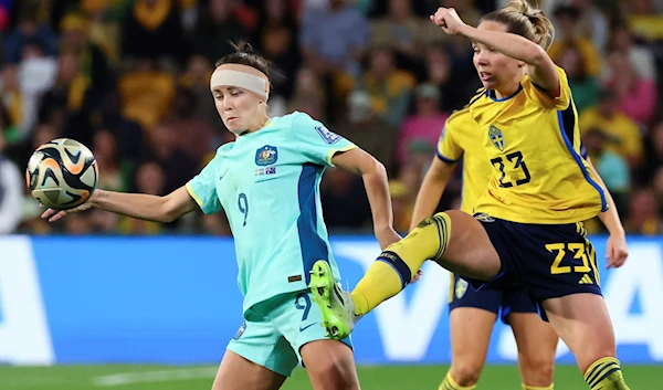 Sweden's Elin Rubensson, right, and Australia's Caitlin Foord compete for the ball during the Women's World Cup third place playoff soccer match between Australia and Sweden in Brisbane, Australia, Saturday, Aug. 19, 2023. (AP)