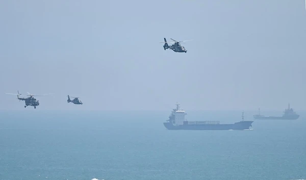 Chinese military helicopters fly past Pingtan island, one of mainland China's closest point from Taiwan, in Fujian province on August 4, 2022. (AFP)