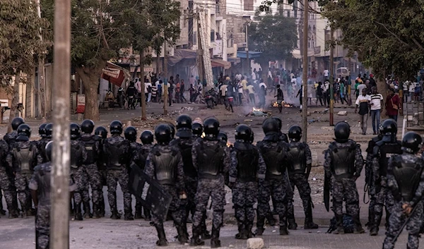 Senegalese Gendarmerie block a road after protests burned tires and blocked roads in Dakar, on June 3, 2023 (AFP)