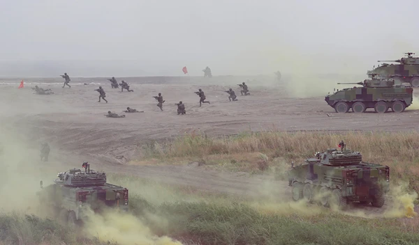 Soldiers participate in the annual Han Kuang military exercises that simulate an anti-landing operations near the coast in New Taipei City, Thursday, July 27, 2023 (AP Photo/Chiang Ying-ying)