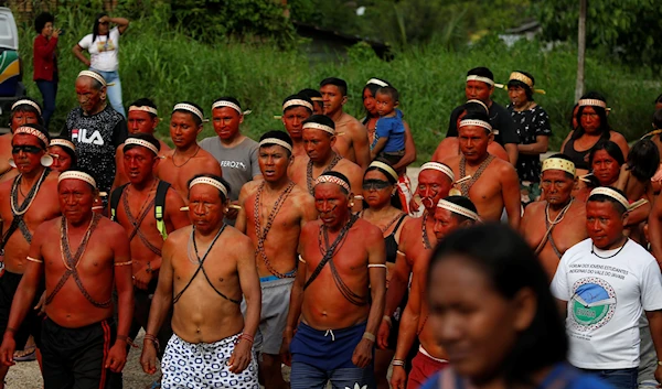 Indigenous people march to protest against the killings of Indigenous expert Bruno Pereira and freelance British journalist Dom Phillips, in Atalaia do Norte, Vale do Javari, Amazonas state, Brazil, June 13, 2022 (AP)