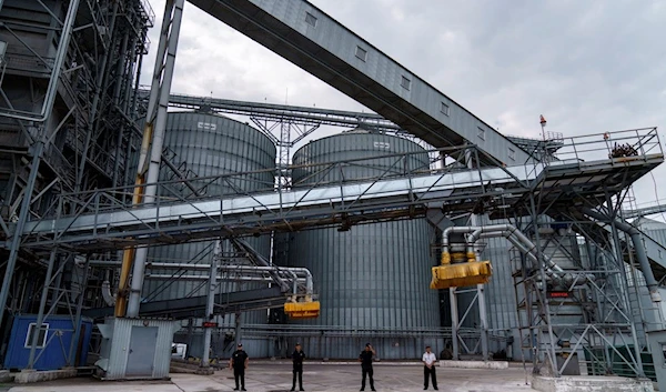 Security personnel stand in front of a grain storage terminal at the Odessa Sea Port, in Odessa, Ukraine, on July 29, 2022 (AP Photo/David Goldman, File)