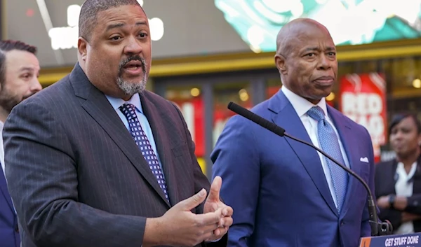 New York Mayor Eric Adams on the right speak at a news conference in the city's Times Square, on October 11, 2022. (AP)