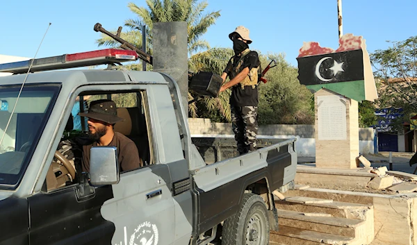 Libyan security forces stand guard in Tripoli, Libya, Tuesday, Aug. 16, 2023 (AP)