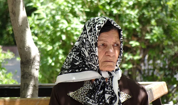 Elderly Woman in Lona Park, Tabriz, Iran, photographed on June 2012. (Wikimedia Commons)