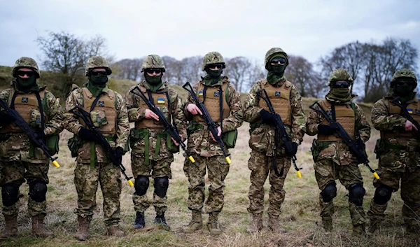 Ukrainian soldiers take part in a training session in Wiltshire, England where Australian Armed Forces are supporting the UK-led training of Ukrainian recruits, on February 1, 2023 (AFP)