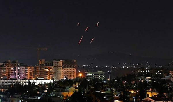 File photo shows Syrian Air defenses respond to alleged Israeli missiles targeting south of the capital Damascus, on July 20, 2020. (AFP)