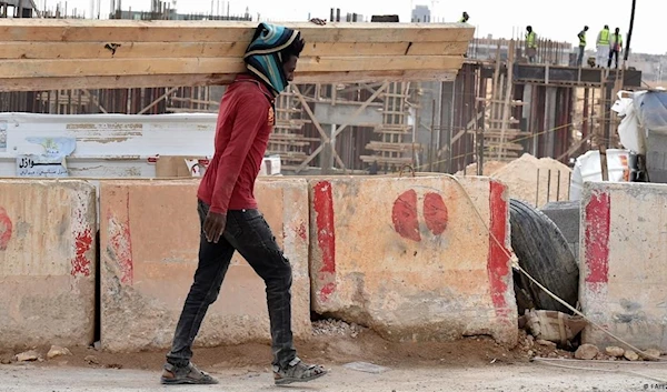 An Ethiopian immigrant working in construction in Saudi Arabia. (AFP)