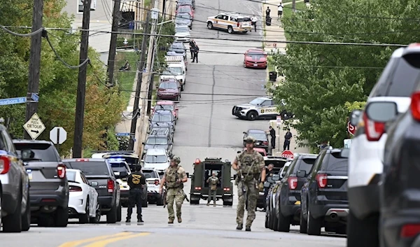 Pittsburgh police and law enforcement personnel arrive to the shooter scene in the Garfield neighborhood in Pennsylvania on August 23, 2023 (AP)