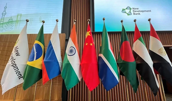 Flags are seen displayed at the opening ceremony of the New Development Bank Eighth Annual Meeting in Shanghai on May 30, 2023. (AFP)