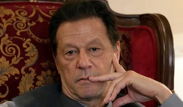 Pakistan's former prime minister Imran Khan listens to a member of media during talk with reporters regarding the current political situation and the ongoing cases against him at his residence, in Lahore, Pakistan, Thursday, Aug. 3, 2023. (AP)