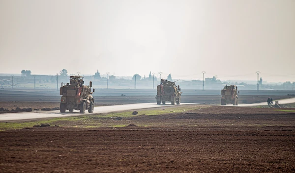 US occupation vehicles on a patrol in the countryside near the town of Qamishli, Syria, Dec. 4, 2022 (AP)