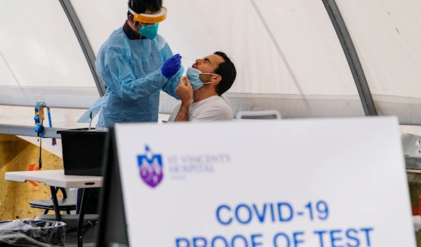 A man receives a COVID-19 test in the eastern suburbs of Sydney Tuesday, September 14, 2021 (AFP)