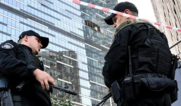 Russian police officers blocking off the area around a damaged office block at the Moscow International Business Centre following a drone attack in Moscow on August 1, 2023. [AFP]