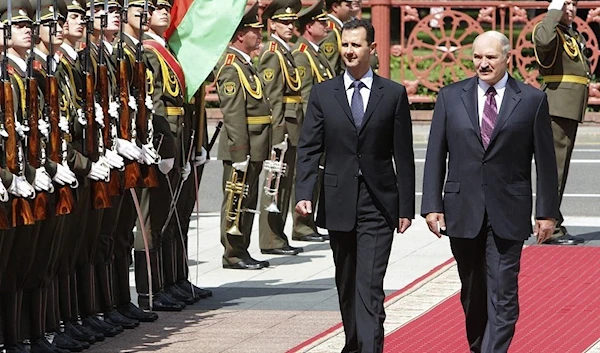 Belarus President Alexander Lukashenko and his Syrian counterpart Bashar Assad are seen during a meeting in Minsk, Belarus, Monday, July 26, 2010 (AP)