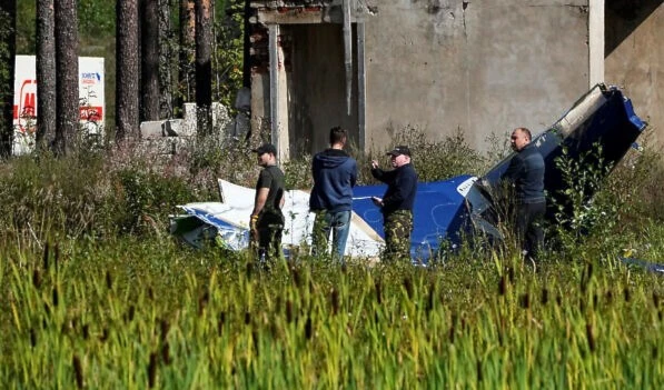 Russian servicemen inspect a part of a crashed private jet near the village of Kuzhenkino, Tver region, Russia, August 24, 2023. (AP)