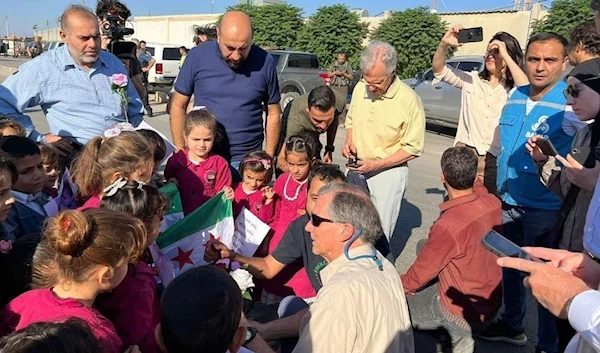 US congressman pose for pictures with Syrian kids in north Aleppo August 27 2030 (social media)