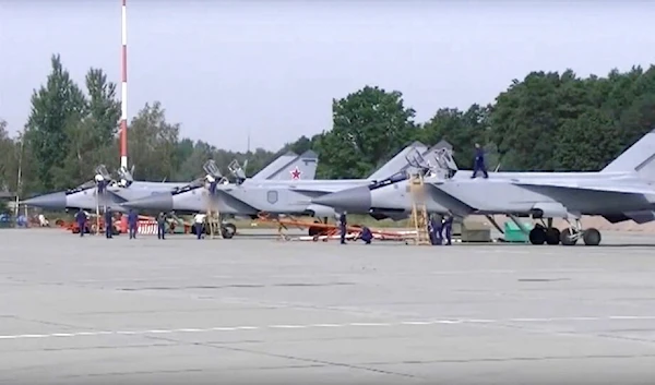 In this handout photo taken from video released by Russian Defense Ministry Press Service on Thursday, Aug. 18, 2022, three MiG-31 fighter jets of the Russian air force stand after lending at the Chkalovsk air base in the Kaliningrad region. (AP)