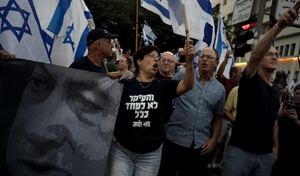 Israelis march in support of the judicial system during a protest against the plans by Prime Minister Benjamin Netanyahu's government to overhaul it, in 'Tel Aviv', occupied Palestine, Aug. 2, 2023 (AP)