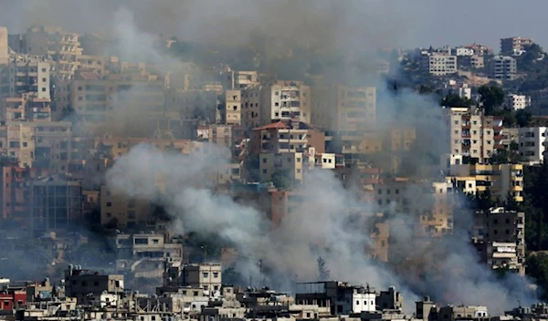 Smoke rises from buildings in Ain el-Helweh, Lebanon's largest Palestinian refugee camp, near the southern coastal city of Sidon, during clashes between Palestinian forces and Islamist fighters on August 19, 2017.(AFP)