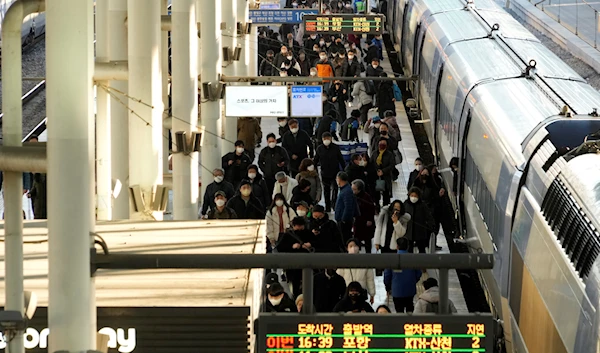 Passengers exit a train at the Seoul Railway Station in Seoul, South Korea, Feb. 20, 2023 (AP)