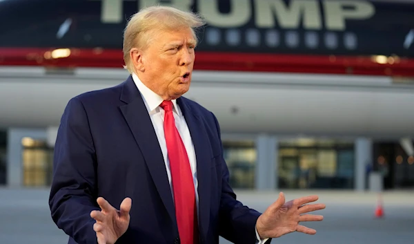 Former President Donald Trump speaks with reporters before departure from Hartsfield-Jackson Atlanta International Airport, Aug. 24, 2023, in Atlanta, Georgia (AP)