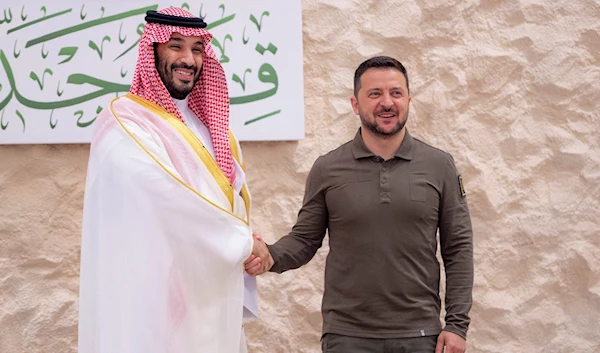 Saudi Crown Prince Mohammed bin Salman greets Ukraine's President Volodymyr Zelensky, right, during the Arab summit in Jeddah, Saudi Arabia, on May 19, 2023. (Saudi Press Agency/AP)