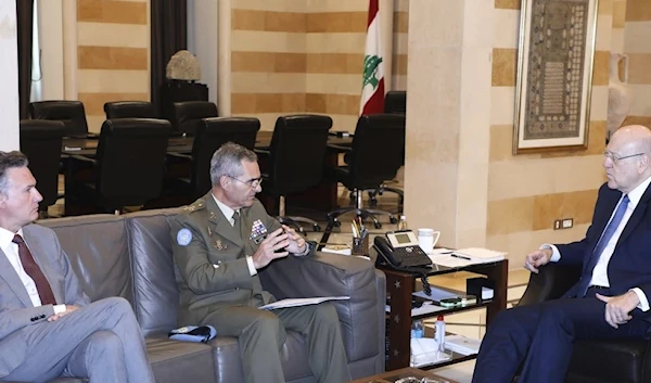 Photo shows Lebanese caretaker Prime Minister Najib Mikati, right, meeting with the Head of Mission and Force Commander of the UNIFIL, Major General Aroldo Lazaro Saenz of Spain, center, in Beirut, Lebanon, Monday, July 10, 2023. (AP)