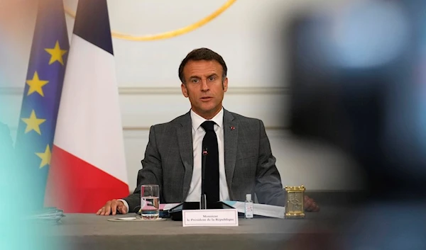 French President Emmanuel Macron speaks as he chairs a cabinet meeting after a cabinet reshuffle Friday, July 21, 2023 at the Elysee Palace in Paris. (AP)