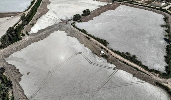 This aerial view shows dry fish farms in the village of Albu Mustafa in Hilla, about 100 km (62 miles) south of Baghdad on July 6, 2023. (AFP)