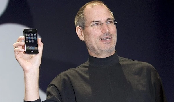 Apple CEO Steve Jobs holds up the new iPhone that was introduced at Macworld on January 9, 2007, in San Francisco. (AFP)