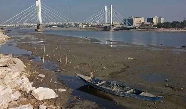 An aerial view shows the Hadarat bridge across the Euphrates river that is witnessing a sharp decrease in water levels, in Nassiriya on February 26, 2023. (AFP)