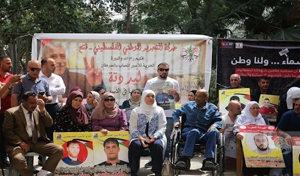 Protest held in front of Red Cross office in al-bireh city, West Bank, in support of prisoners (WAFA)