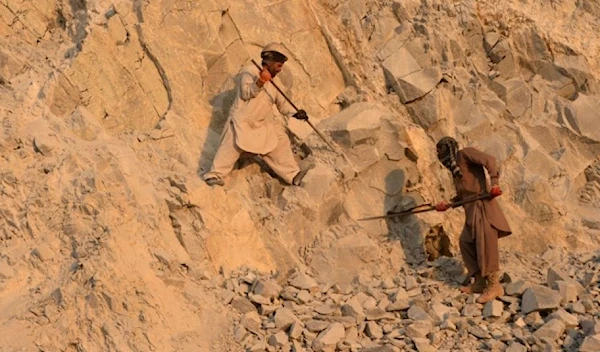 Afghan laborers work at a stone mine on the outskirts of Jalalabad, Afghanistan, on Dec. 27, 2016. (AFP via Getty Images)