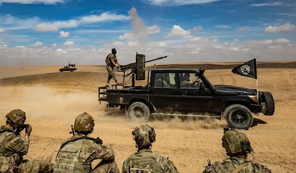 The Syrian Democratic Forces (SDF) in military practices with the US occupation troops on March 25, 2022 (AFP)