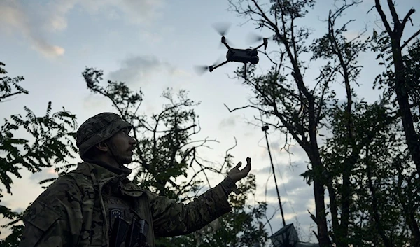 A soldier of Ukraine's 3rd Separate Assault Brigade launches a drone near Bakhmut, the site of fierce battles with the Russian forces in the Donetsk region, Ukraine, Sunday, Sept. 3, 2023. (AP)