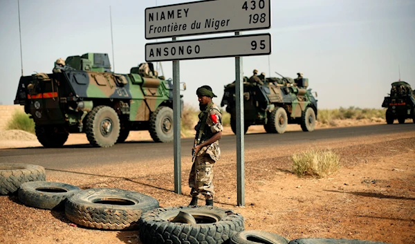 French armoured vehicles are seen heading towards the Niger border before making a left turn north in Gao, northern Mali, Wednesday Feb. 6, 2013. (AP)