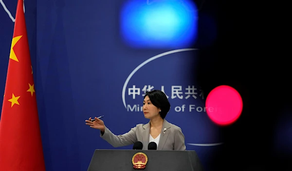 Chinese Foreign Ministry spokesperson Mao Ning gestures during a press conference at the Ministry of Foreign Affairs in Beijing, Wednesday, July 26, 2023 (AP)