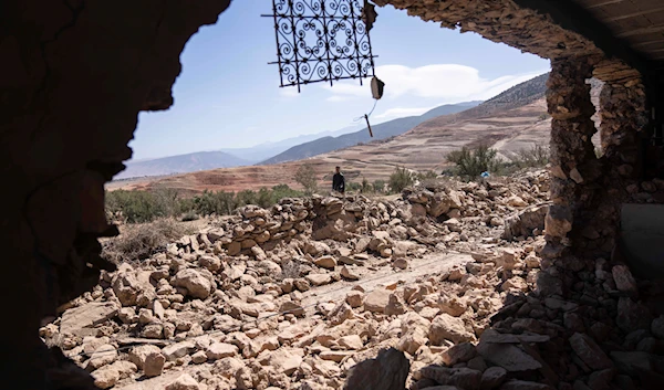 A man walks past rubble caused by the earthquake in the village of Tafeghaghte, near Marrakech, Morocco, Sept. 11, 2023 (AP)