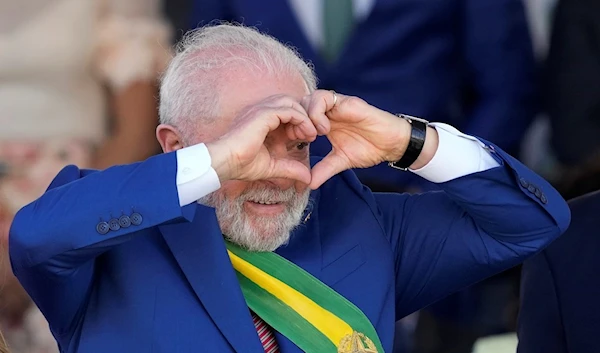 Brazilian President Luiz Inacio Lula da Silva makes a heart sign during a military parade on Independence Day in Brasilia, Brazil, Thursday, Sept. 7, 2023 (AP Photo/Eraldo Peres)