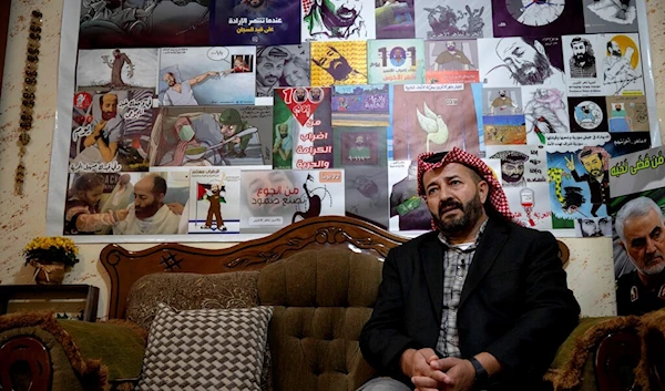 Former Palestinian prisoner Maher al-Akhras, poses for a photo, a year after being released from an Israeli prison following a 103-day hunger strike, at his house in the West Bank village of Silat Al-Dahar, Wednesday, Dec. 1, 2021.