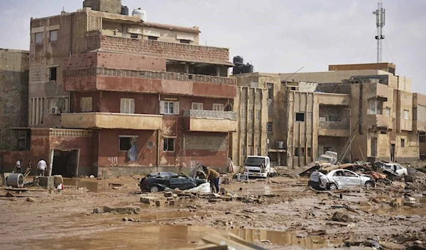 In this photo provided by the Libyan government, cars and rubble sit in a street in Derna, Libya, on Monday, Sept. 11, 2023, after it was flooded by heavy rains (Libyan government/AP)