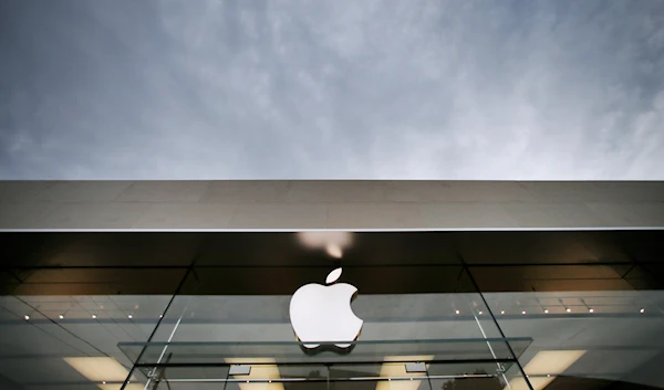 Storm clouds fill the sky above the Apple store, Thursday, Sept. 19, 2013, in Dallas. Apple is schedule to release their iPhone 5S on Friday. (AP)