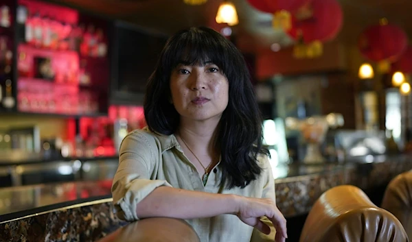 Ashley Cheng poses for a photo at her father's restaurant, Chinatown, in Austin, Texas, June 28, 2023. (AP)